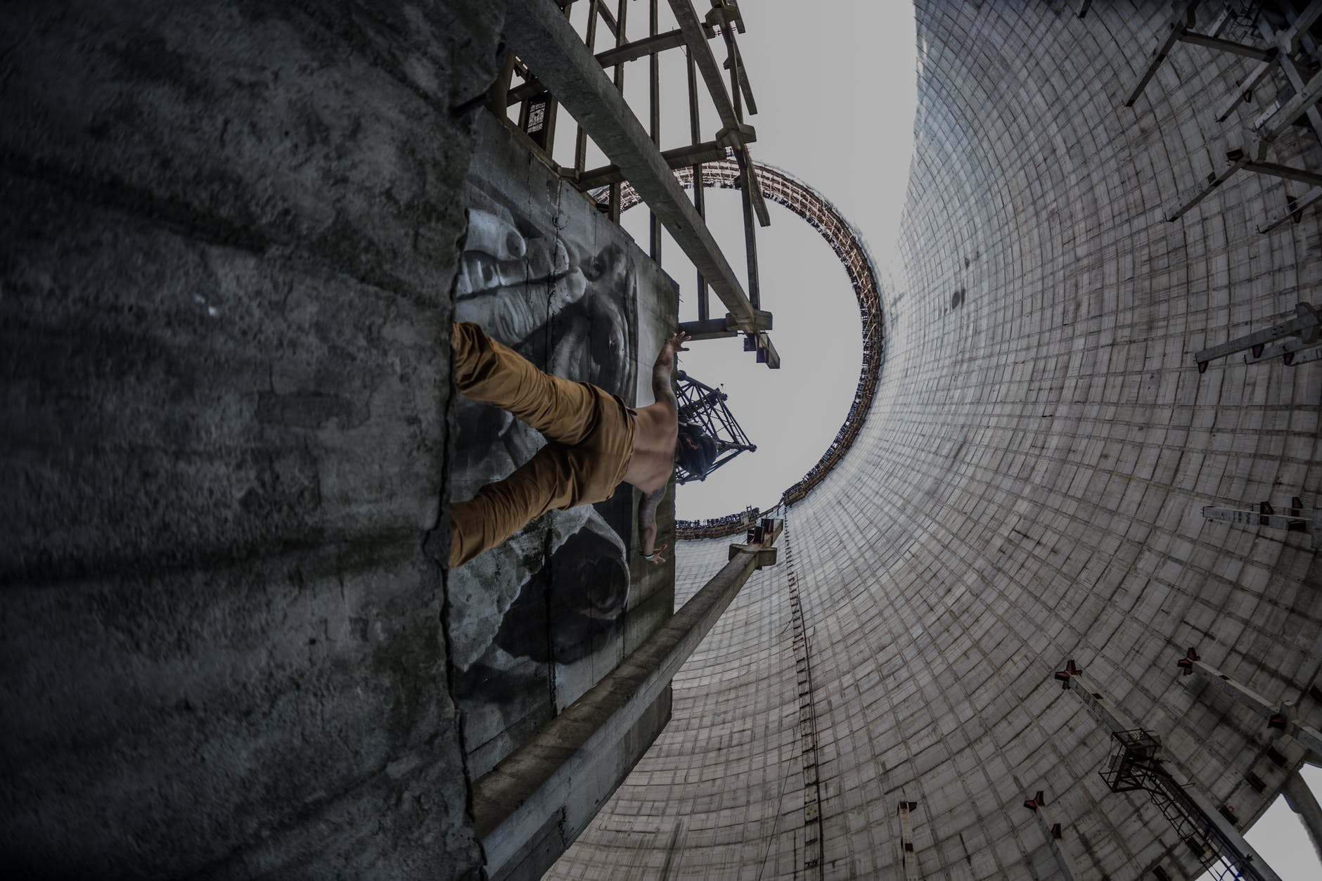 low angle photo of topless man on concrete platform