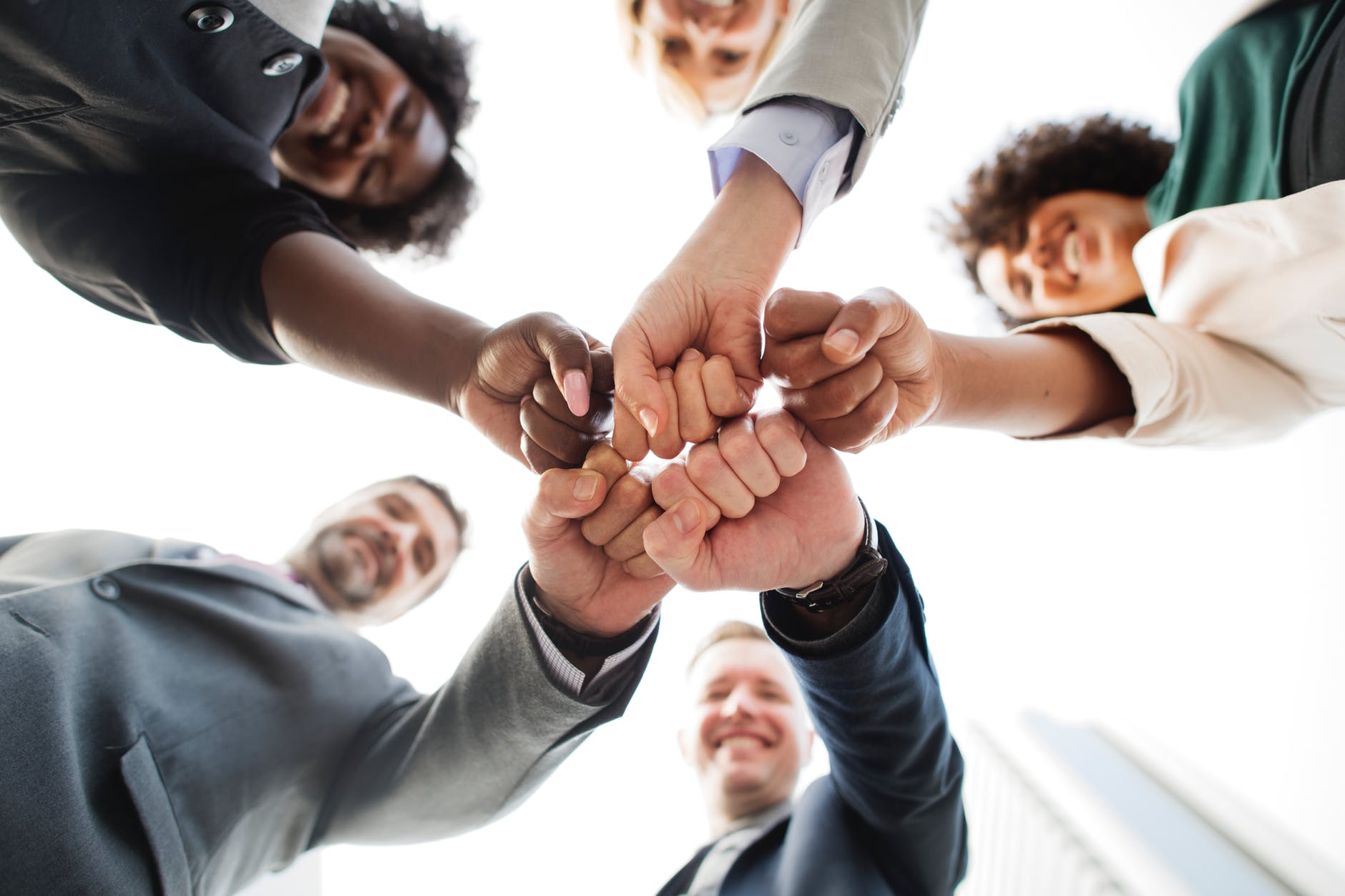 photo of people doing fist bump