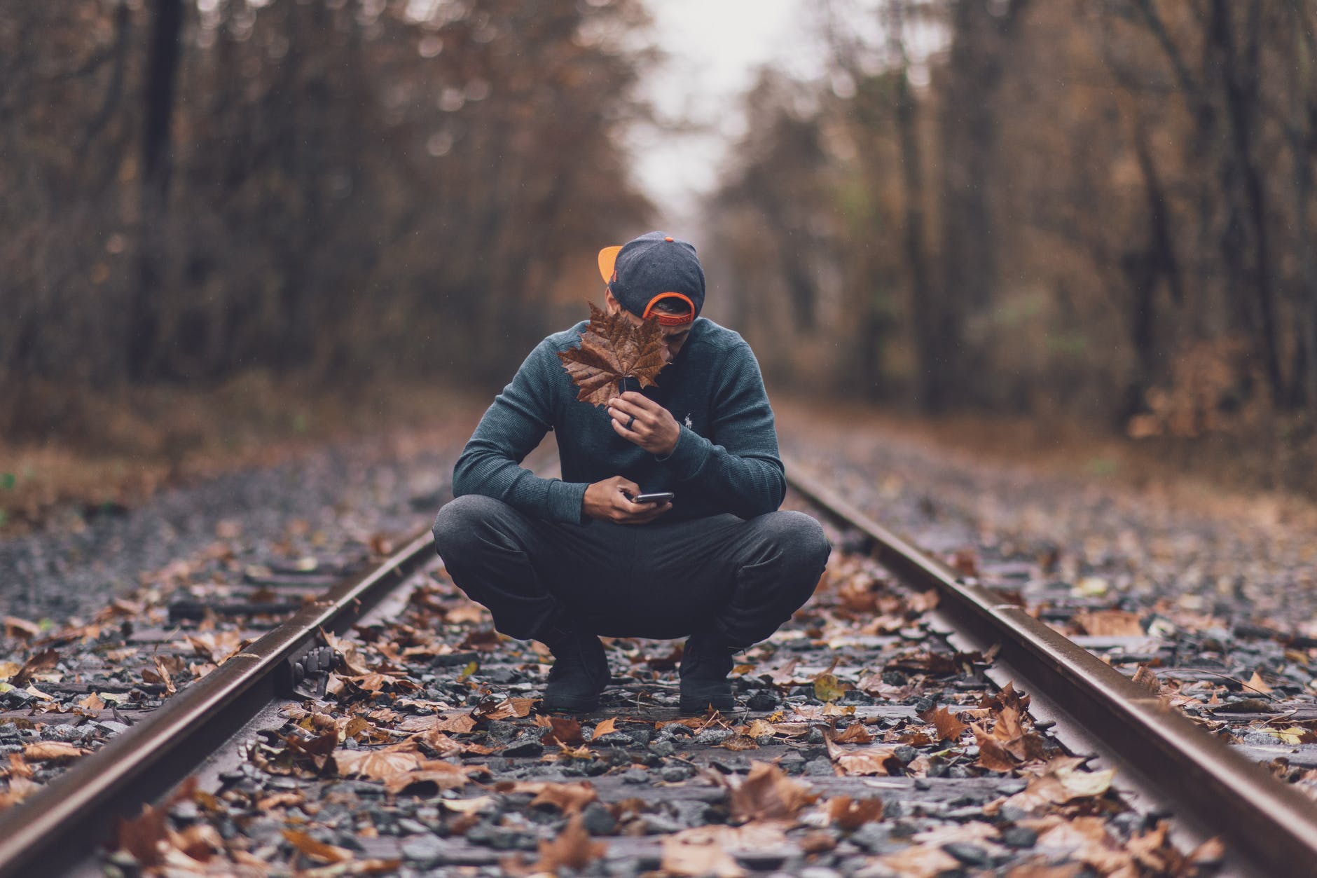 photo of man on railway