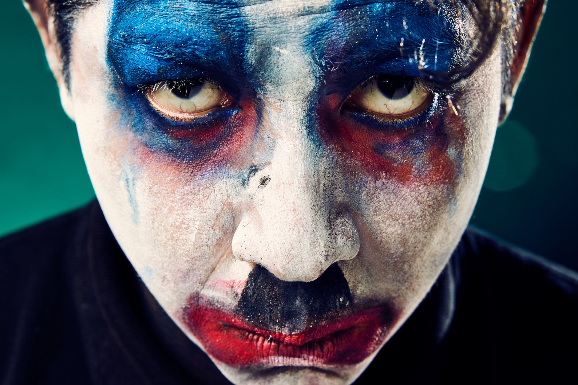 man with face make up