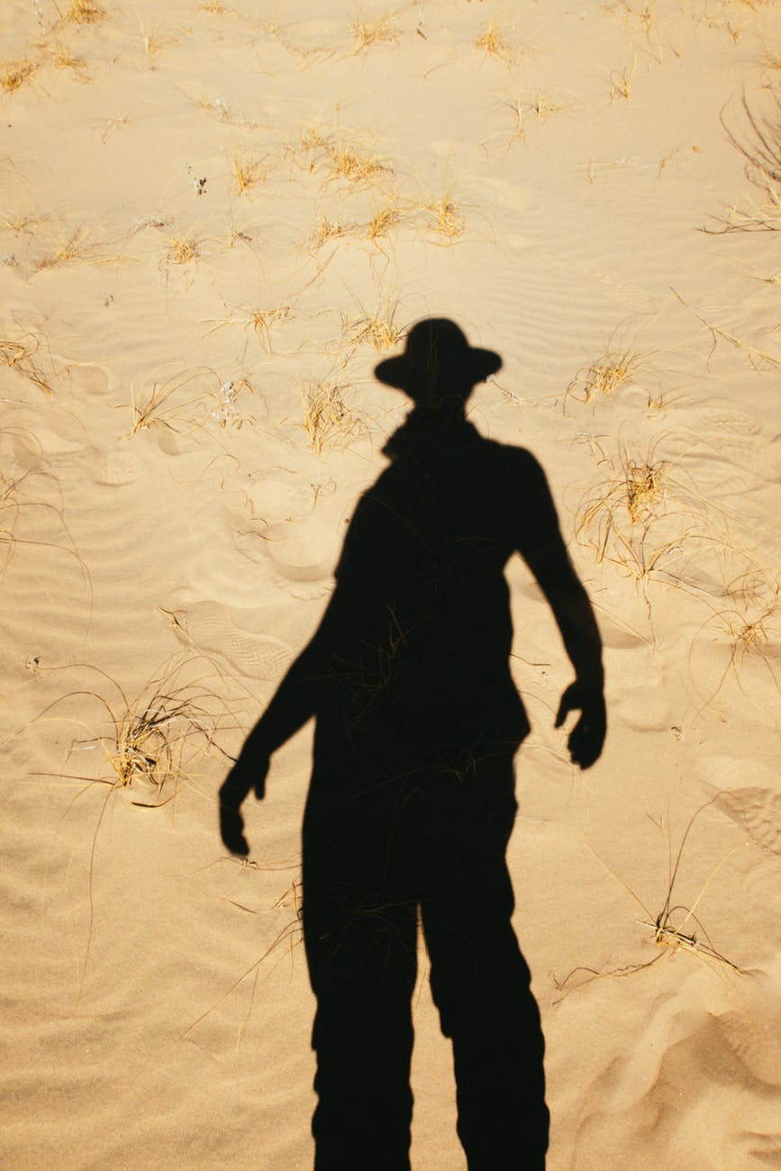 shadow of person on sand